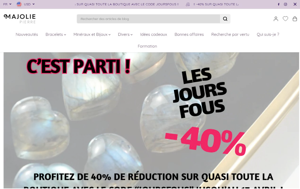 Capture d'écran de la page d'accueil du site web de Majolie Pierre affichant une bannière de soldes offrant 40 % de réduction sur la quasi-totalité des articles, avec des images de perles en pierre précieuse en arrière-plan.