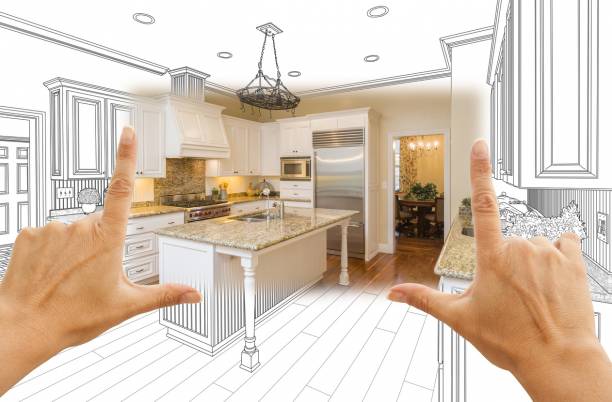 Les mains encadrent une cuisine moderne ; la moitié de la scène est une cuisine terminée, tandis que l'autre moitié est une esquisse architecturale en noir et blanc montrant le processus de conception.